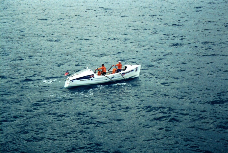 Two men rowing a boat
