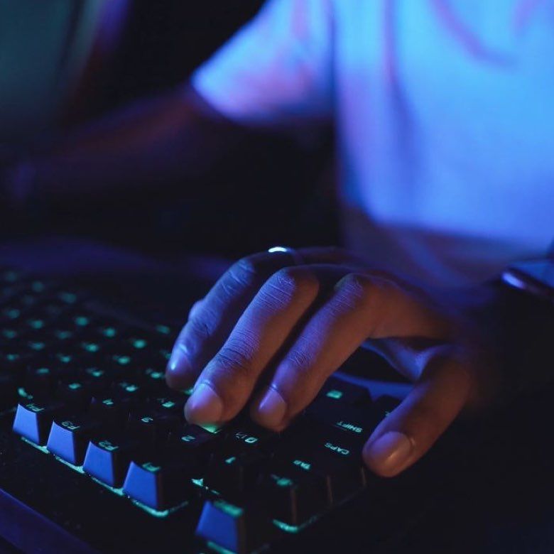 Close up of hands using a keyboard